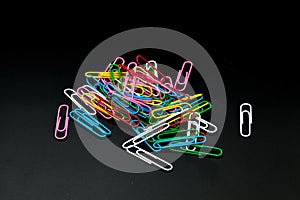 Pile of different color paper clip