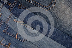 Pile of different jeans, back side