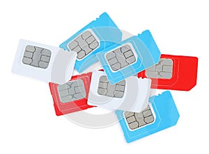 Pile of different SIM cards on white background, top view
