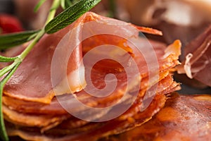 A pile of different spanish embutido, jamon, chorizo and lomo em photo