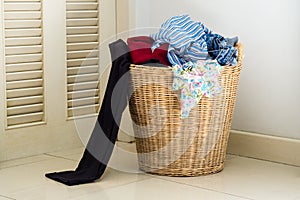 Pile of dirty clothes in washing basket