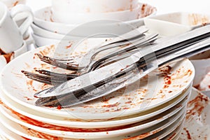 Pile of dirty dishes and cutlery