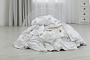 Pile of dirty laundry on floor