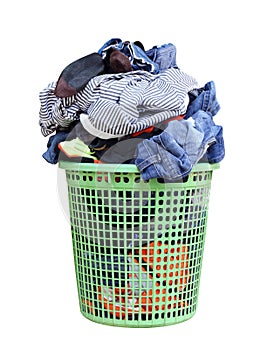 Pile of dirty laundry in a washing basket, laundry basket with colorful towel, basket with clean clothes, colorful clothes in a la