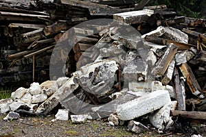 Pile of dirty styrofoam and weathered baulk timber