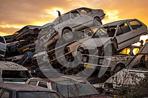 Pile of discarded cars on junkyard