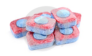 Pile of dishwasher detergent tablets on white background