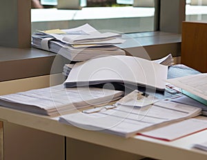 Pile of document on desk at office