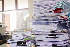 Pile of documents on desk photo