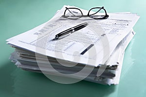 Pile of documents and tax form photo