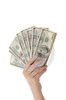 Pile of dollars in female hand (isolated)