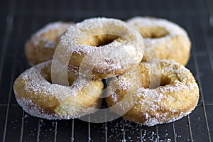 Pile of 5 Doughnuts on a dark background