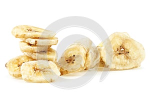 Pile of dried banana slices isolated on white background. Banana chips
