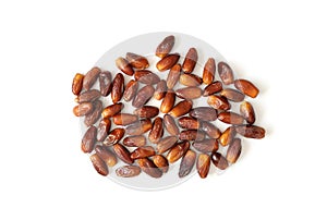 A pile of dried dates isolated on a white background. Oriental sweets. Flat lay, top view