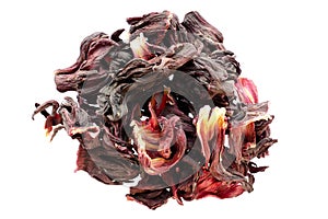 Pile of dried karkade flowers isolated on white background, top view. Red aromatic hibiscus tea. Dry tea leaves hibiscus