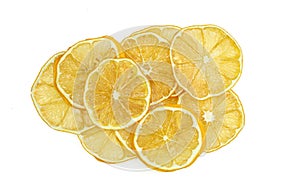 Pile of dried lemons slices isolated on white background.