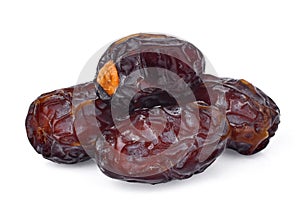 Pile of dried medjool date fruit isolated on white