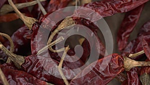 Pile of dried red chili peppers background. Hot and spicy dry famous red chillies top view.