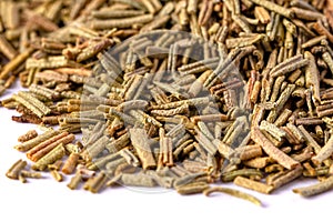 Pile of dried rosemary leaves isolated on white background. condiments