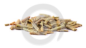 Pile of dried rosemary leaves isolated on white background. Macro photo