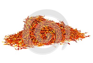 Pile of dried saffron spice on white background