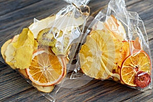 pile of dried tropical fruits on wooden background