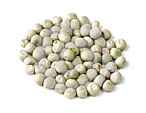 Pile of dried whole green peas closeup on white