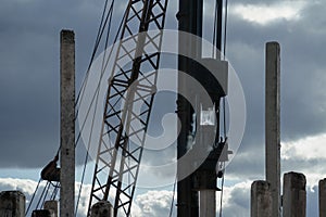 Pile driver install piles on the construction site at daytime