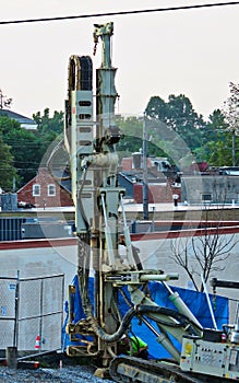 Pile driver at work on a construction site.