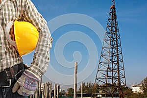 Pile driver works to set precast concrete piles in a constructi