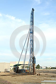 Pile driving crane on construction site