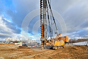 Pile driving machine on a construction site