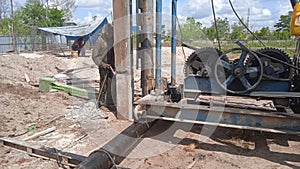 Diesel hammer pile driving machine working on construction site