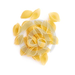 Pile of dry conchiglie pasta over isolated white background