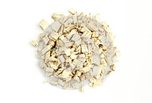 Pile of dry marshmallow roots isolated on white background. Althaea officinalis chopped