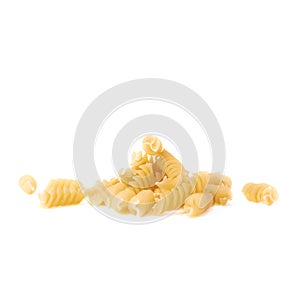 Pile of dry pasta rotini over isolated white background