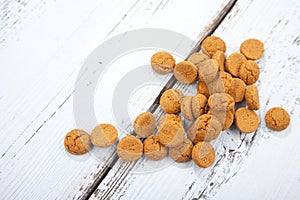 Pile of Dutch candy pepernoot on wooden background