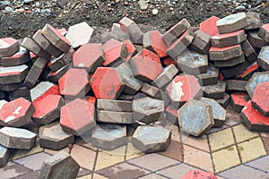 Pile of dyed red cubes for making outdoor pavement tiles