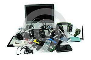 Pile of electronic waste, gadgets for daily use isolated on white background photo