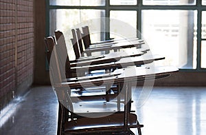 A pile of empty school chairs