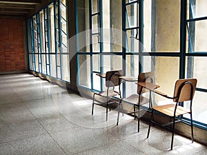 A pile of empty school chairs