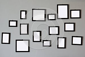 Pile of empty wooden picture frames on wall