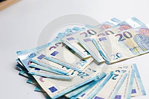 Pile of Euro money note bills on white background