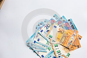 Pile of Euro money note bills on white background