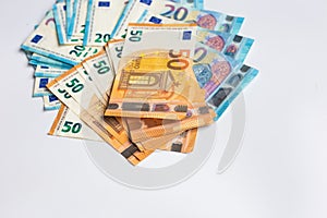 Pile of Euro money note bills on white background