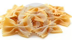 Pile of farfalle pasta with a bowtie shape on white background.