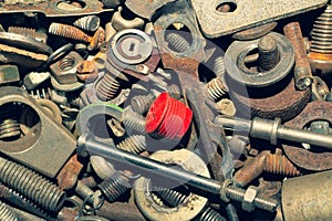 Pile of fasteners and screws close up. scrap metal. different metal details