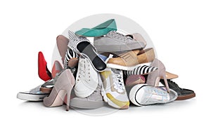 Pile of female shoes on white