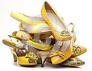 Pile of female yellow shoes