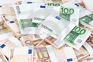 Pile of fifty and one hundred euro banknotes